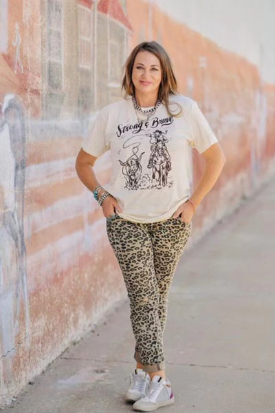"strong & brave" cowgirl graphic tee